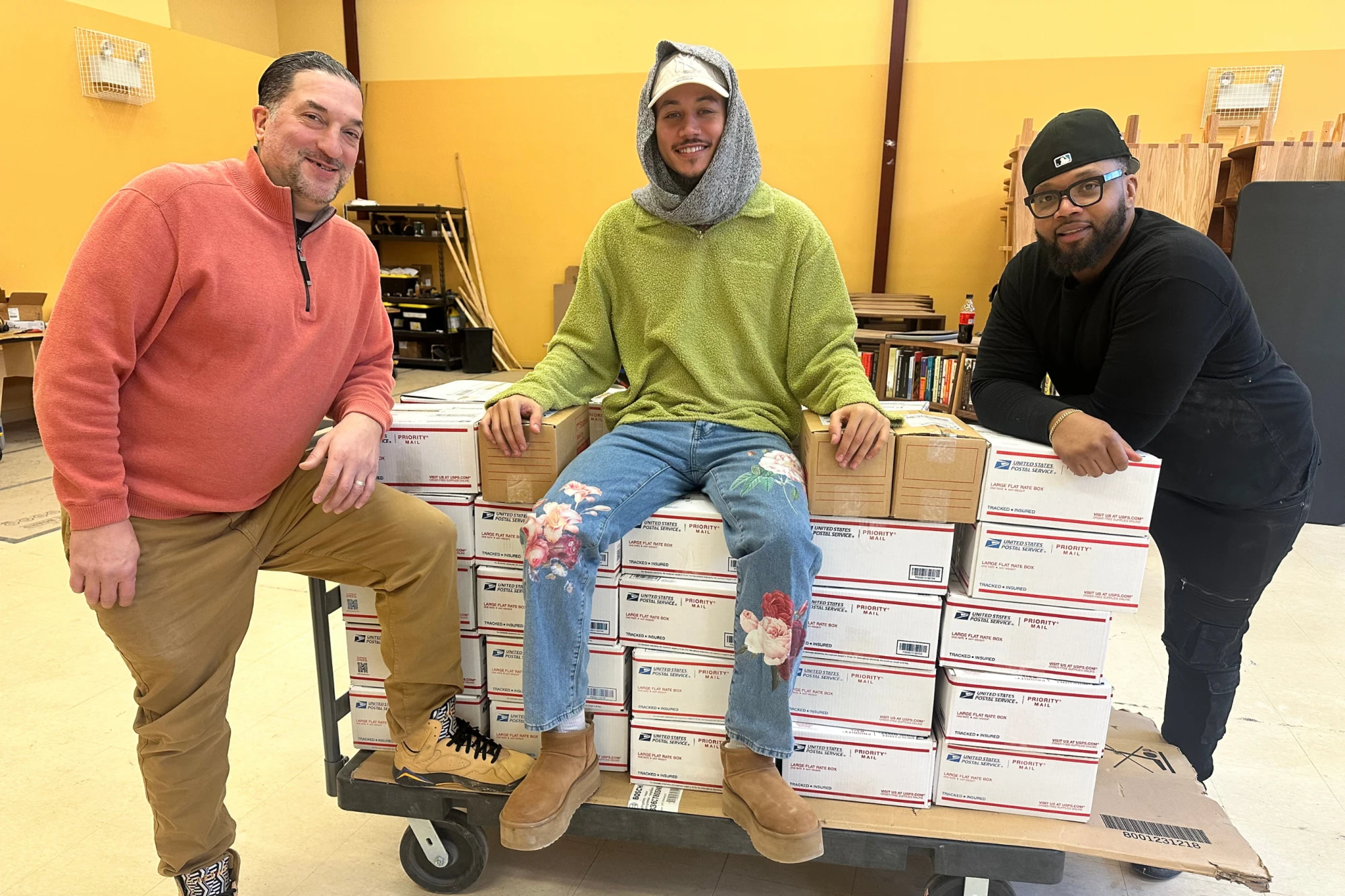 Freedom Reads team members (from left to right) Jimmy Flynn, David Perez DeHoyos, and Michael Byrd with the packed shortlisted books for Inside Literary Prize 2025. Freedom Reads team members (from left to right) Jimmy Flynn, David Perez DeHoyos, and Michael Byrd posing with boxes of books.