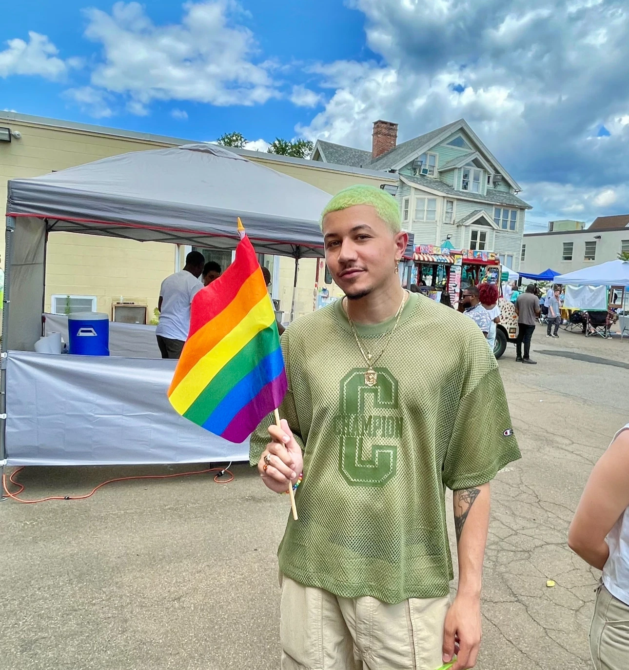 Freedom Reads Library Coordinator David Perez Jr Freedom Reads Library Coordinator David Perez Jr holds a Pride flag
