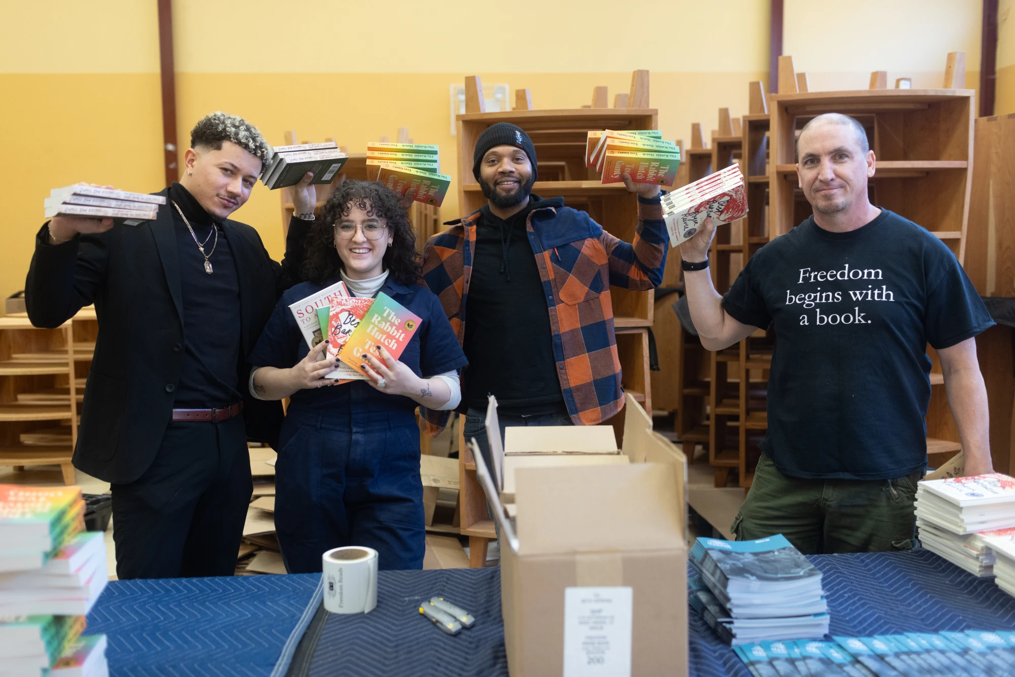 Freedom Reads team members (from left to right) David, Gabby, Mike, and Steven with the four books shortlisted for the Inside Literary Prize. Freedom Reads team members (from left to right) David, Gabby, Mike, and Steven with the four books shortlisted for the Inside Literary Prize.